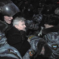 Photo: Edward Limonov being arrested by a gang of Russian riot cops...